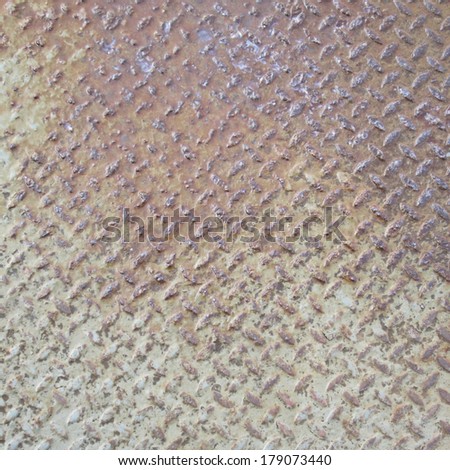 heavy duty rusty metal background with non slip repetitive patten. Concept image for urbanization, steampunk, construction, safety at work, oxidation