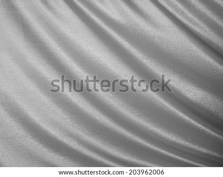 Luxurious silver satin/silk folded fabric, useful for backgrounds