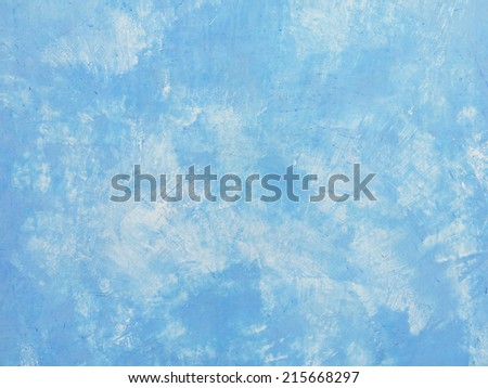 The old blue paint cement wall background of a house, abrasive paint