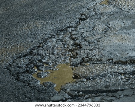 Similar – Foto Bild alte verlassene Asphaltstraße mit verunstalteten Fahrbahnmarkierungen