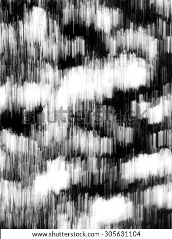 Abstract zoom motion blur background of the lone tree in black and white