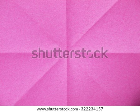 pink sheet of paper folded texture