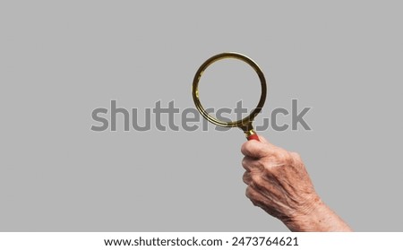 Image, Stock Photo Senior woman with magnifying glass