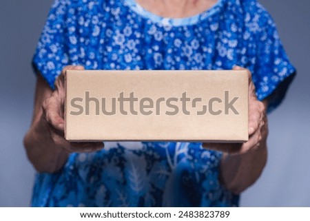 Similar – Image, Stock Photo Woman closing cardboard boxes with seal tape