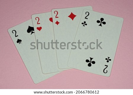 four game cards with deuces lie on a pink table Zdjęcia stock © 