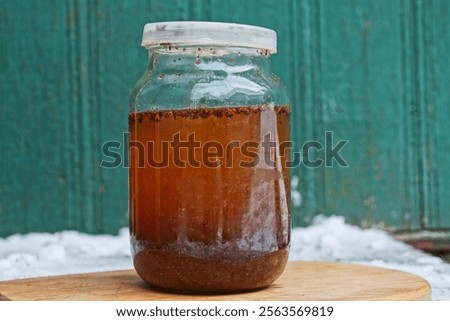 Similar – Image, Stock Photo Brown glass jar near fir branches and pine cones on dark green top view. Brand packaging mockup.