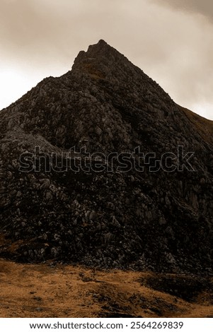 Image, Stock Photo An imposing landscape of rugged mountains and fields that extend to the horizon