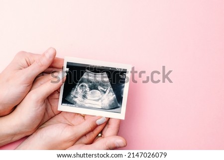 Similar – Image, Stock Photo Pregnant woman with sonogram picture on shore