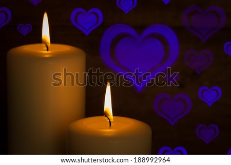 Candles with love hearts in background