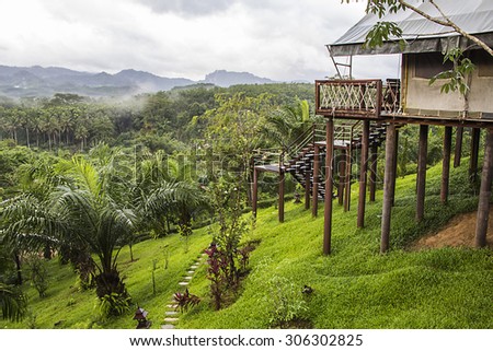 view of mountain with fog in raining season,form Butigue Camp balcony at Surat Thani, Thailand