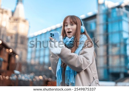 Similar – Image, Stock Photo Headphones connected to smartphone