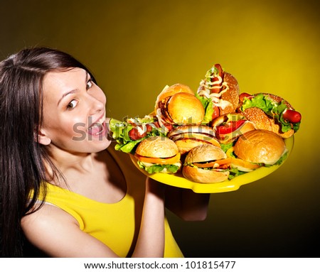 Thin woman holding group hamburger.