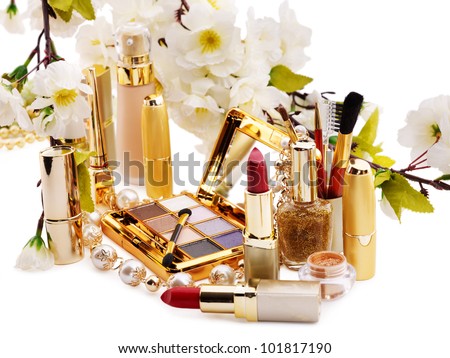 Group decorative cosmetics and flower. Isolated.