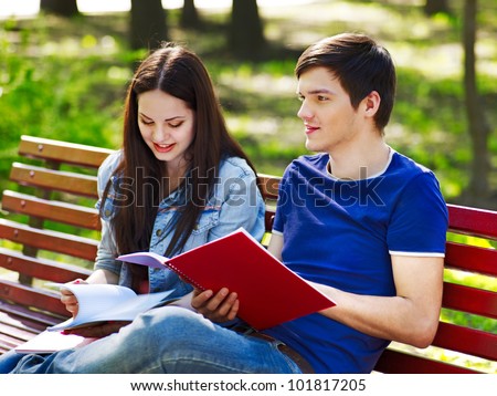 Group student with notebook summer outdoor.