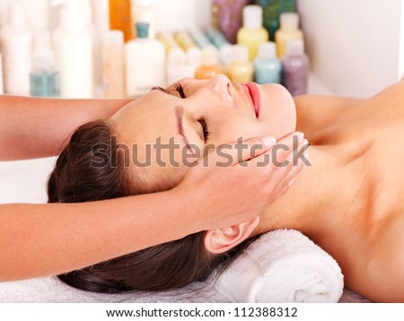 Beautiful woman getting head massage.