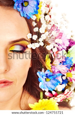 Face of woman with make up and flower. Isolated.