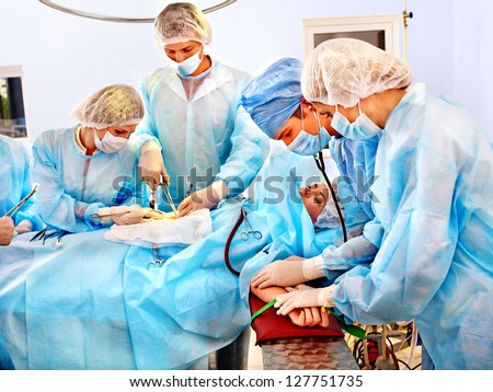 Team surgeon at work in operating room. At work.