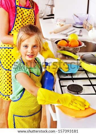Children cleaning  kitchen. Housekeeping.