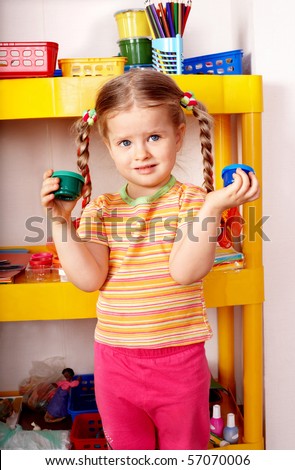 Child with paint in home.