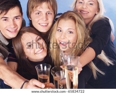 Group young people drink champagne.