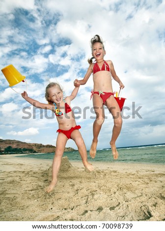 Little girl  playing on  beach.