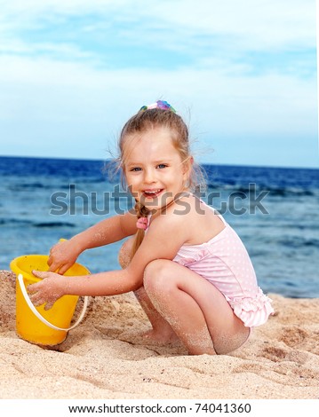 Little Girl Playing On Beach. Stock Photo 74041360 : Shutterstock