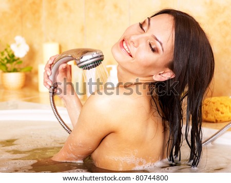 Young woman take bubble  bath.