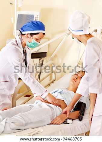 Group doctors treats patient with stethoscope. Medicine.