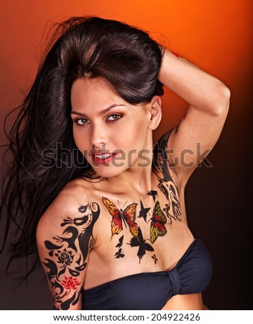 Young woman with body art . Studio shot.