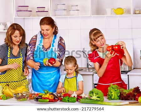 Happy family with child cooking at kitchen. Grandfather and grandmother. kitchen.