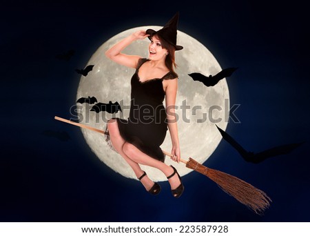 Witch flying on broomstick. Halloween moon.