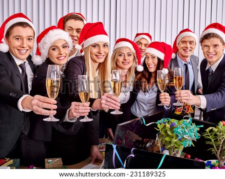 Happy business group people in santa hat drinking champagne  Xmas