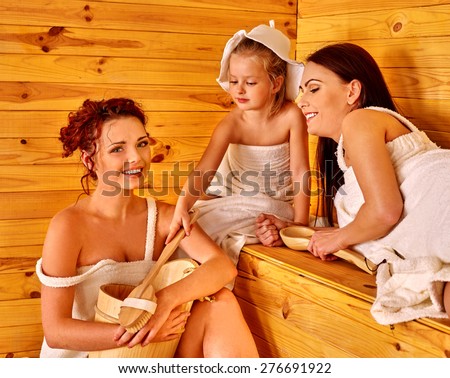 Group people with child in sauna. Healthy lifestyle. Three persons.