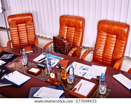 Business interior with  table and leather chair in office. Top view.