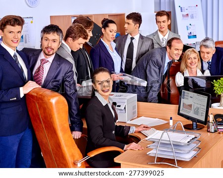 Happy group business people together  in office. Woman look at camera