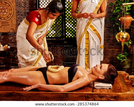 Young woman having dough stomach spa treatment.
