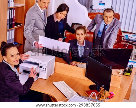 Happy group business people in office. A lot of copy equipment.