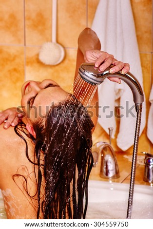 Woman take bubble  bath. Wash hair with water only