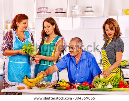 Big family cooking at kitchen. Grandfather and grandmother. Women cooking at home.