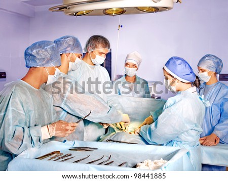 Sick patient on gurney in operating room.