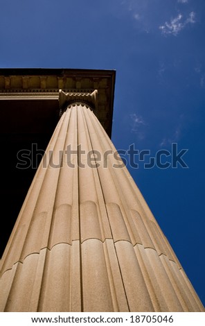 architectural detail of a support column against blue sky