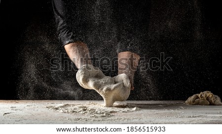 Similar – Image, Stock Photo Cook kneading dough with hand on table