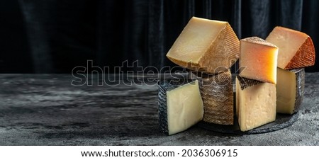 Petit Basque, French cheese, Cheese board of various types of soft and hard cheese. spanish manchego cheese.