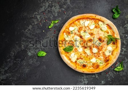 Similar – Foto Bild Pizza mit vier Käsesorten auf dem klassischen blauen Tisch. Pizzascheibe flachgelegt