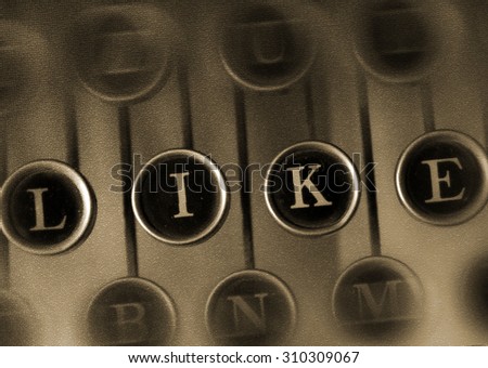 LIKE word on the Vintage Typewriter .\
Keyboard old typewriter with the word LIKE. Retro concept social networks.