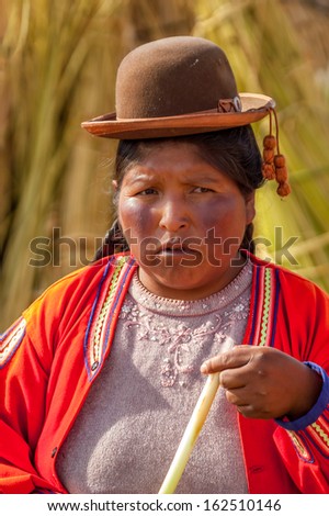 LOS UROS, PERU - NOVEMBER 30,2007 - Native Woman with Hat from Los Uros Island. Los Uros Islands on the Lake Titicaca. Women from the Lake Titicaca wear hats.
