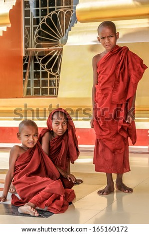 NAYPYIDAW, MYANMAR - NOVEMBER 18,2009 - Young unidentified Monks in Uppatasanti Pagoda.Each boy must pass some time in monastic robes, while attending school.