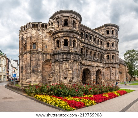 TRIER, GERMANY - AUGUST 22,2014 - The Porta Nigra. Trier lies in a valley between low vine-covered hills of red sandstone in the west of the state of Rhineland-Palatinate.