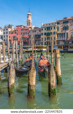VENICE,ITALY - SEPTEMBER 23,2014 - View at the Canal Grande with gondola in Venice.Canal Grande is lined with magnificent palaces. City tour can also take place on the boat - gondola.