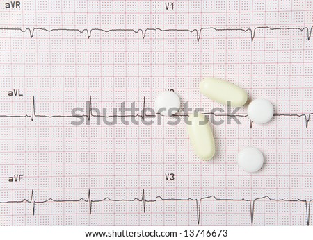 An electrocardiogram, or EKG, with heart pills.